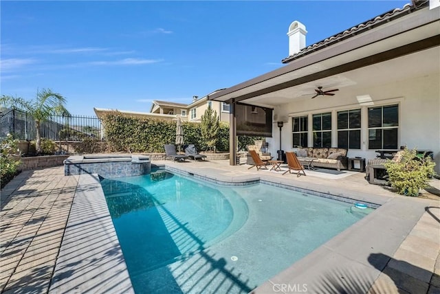 view of pool with a patio area, ceiling fan, and an in ground hot tub