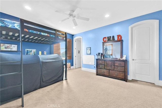 carpeted bedroom featuring ceiling fan