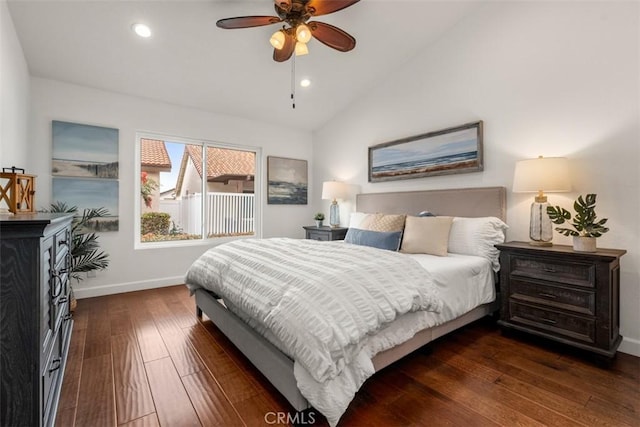 bedroom with lofted ceiling, dark wood-type flooring, and ceiling fan