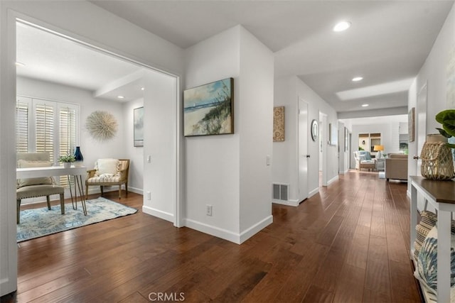 hallway featuring dark wood-type flooring