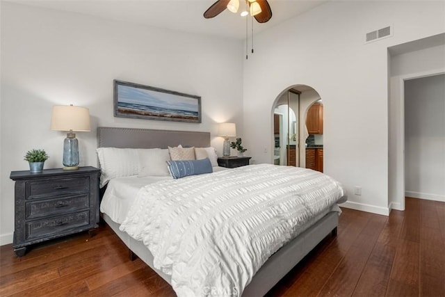 bedroom featuring ceiling fan, high vaulted ceiling, and dark hardwood / wood-style flooring