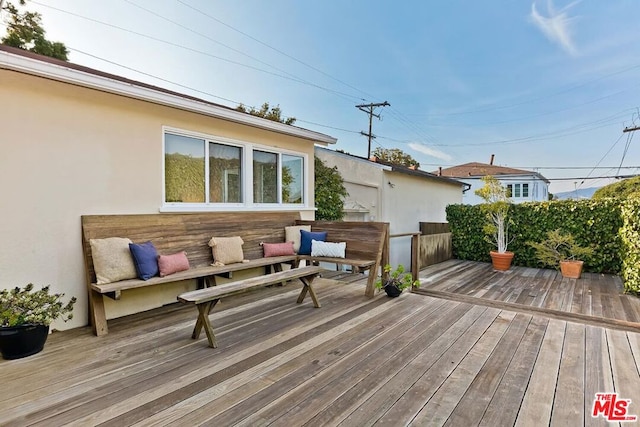 wooden deck featuring an outdoor hangout area