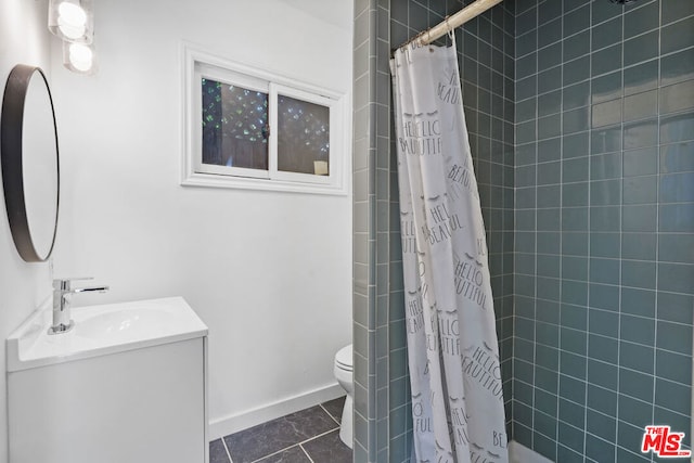 bathroom with a shower with curtain, tile patterned floors, vanity, and toilet