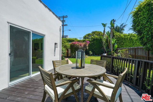 wooden deck with a yard