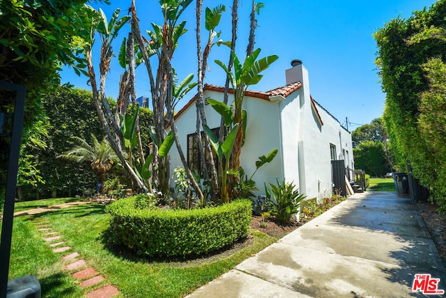 view of home's exterior with a yard