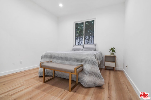 bedroom with wood-type flooring