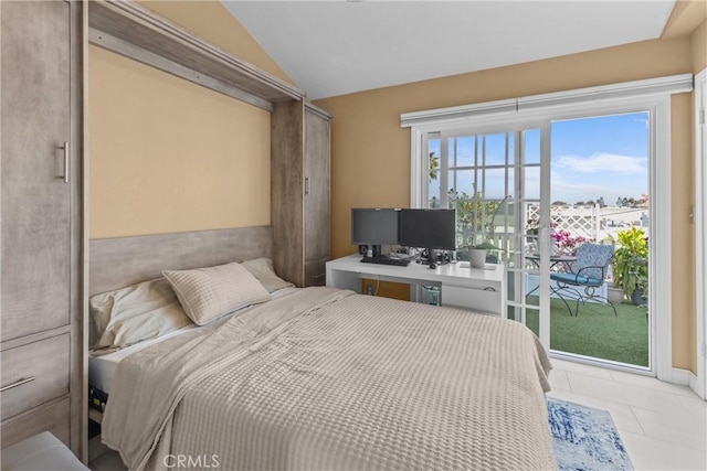 bedroom featuring lofted ceiling, access to exterior, and light tile patterned floors