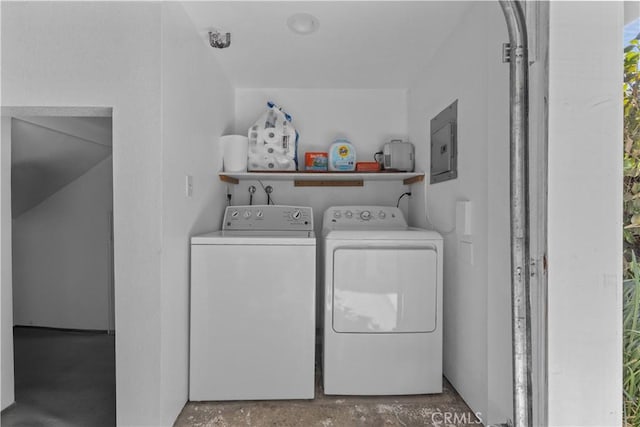 washroom featuring washer and clothes dryer and electric panel