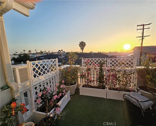 view of balcony at dusk