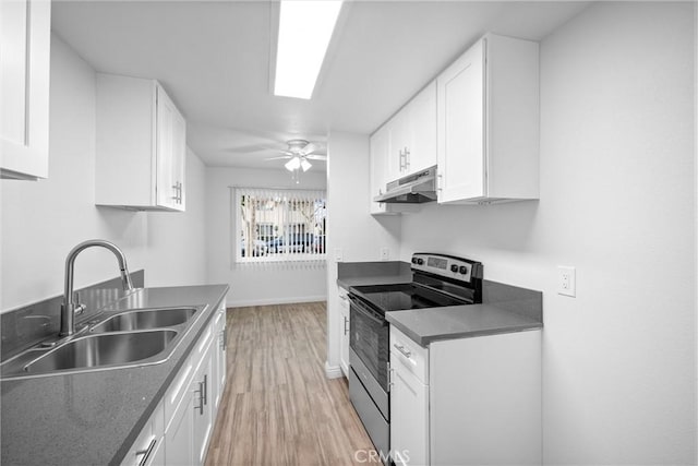 kitchen featuring white cabinetry, ceiling fan, sink, and stainless steel range with electric cooktop