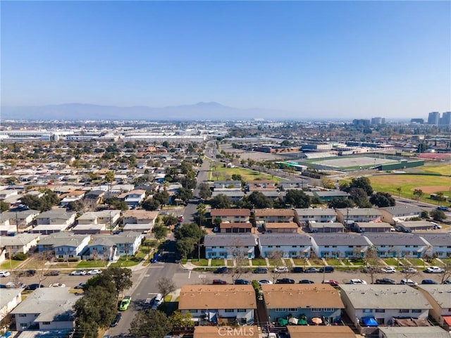 birds eye view of property with a mountain view