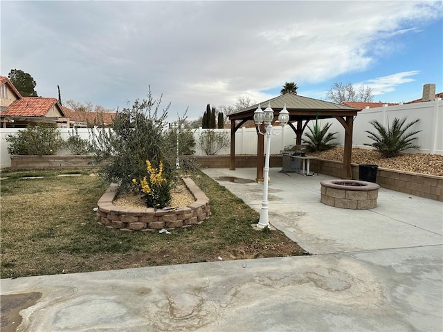 view of yard with a gazebo, a patio area, and an outdoor fire pit