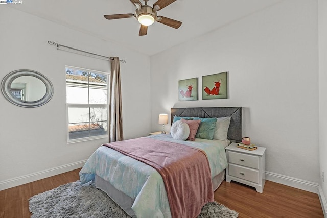 bedroom with hardwood / wood-style floors and ceiling fan