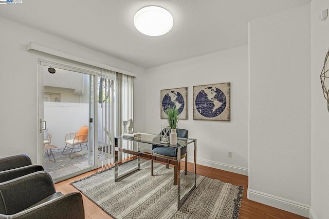 office area with hardwood / wood-style floors