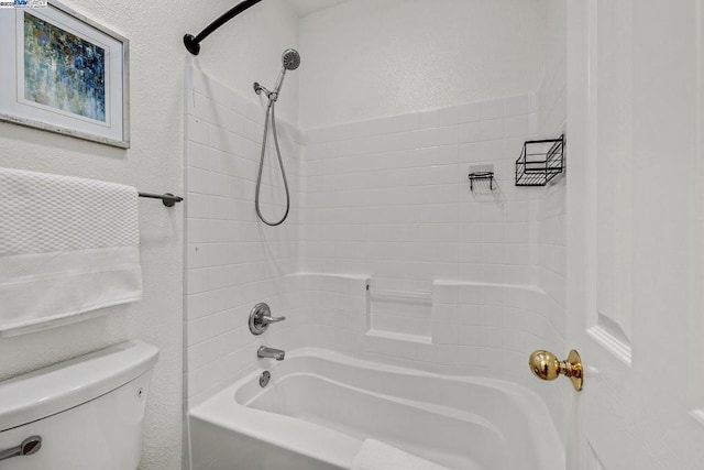 bathroom with shower / bathtub combination and toilet