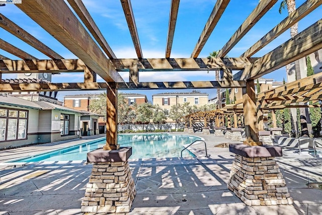 view of pool featuring a pergola and a patio