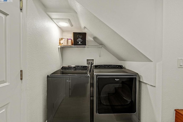 laundry room with washer and dryer