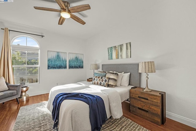 bedroom with hardwood / wood-style floors and ceiling fan