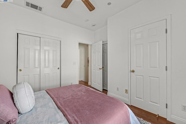 bedroom featuring dark hardwood / wood-style flooring and ceiling fan