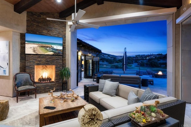 view of patio featuring an outdoor living space with a fireplace