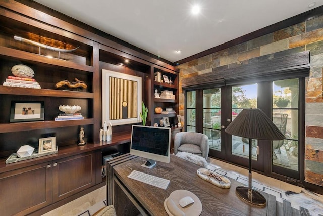 office space with built in shelves and french doors