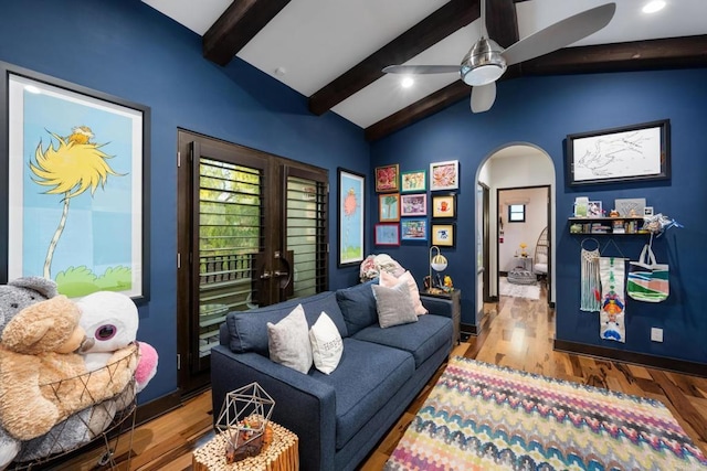 interior space featuring french doors, ceiling fan, lofted ceiling with beams, and hardwood / wood-style floors