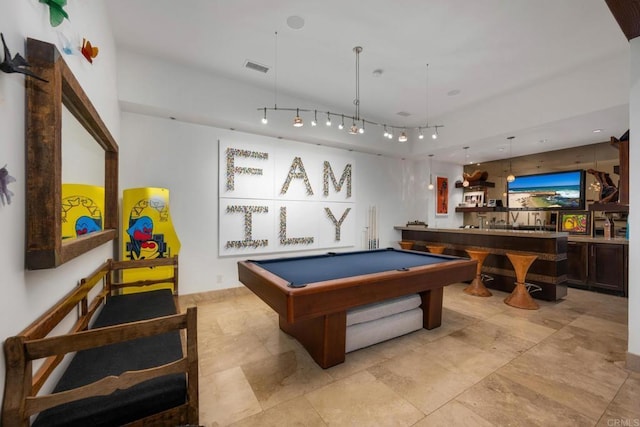 game room featuring pool table and bar area