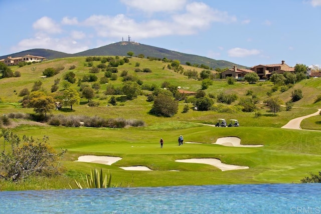 view of home's community with a water and mountain view