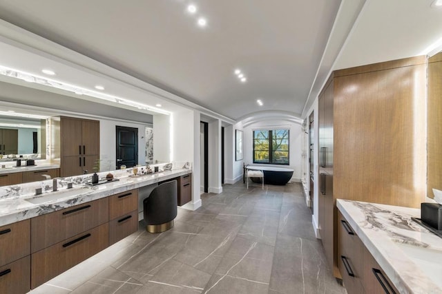 7795 Sendero Angelica, San Diego, CA 92127 - full bathroom with two vanities, a soaking tub, recessed lighting, and lofted ceiling