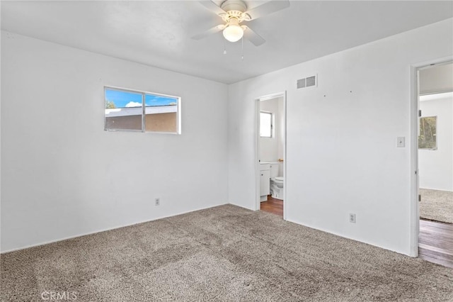 empty room featuring carpet floors and ceiling fan