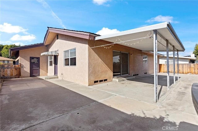 back of property featuring a patio