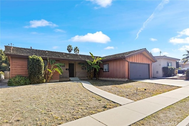 ranch-style house featuring a garage