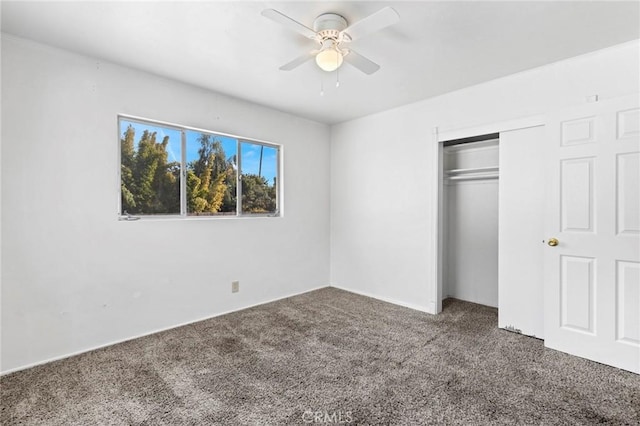 unfurnished bedroom featuring a closet, ceiling fan, and carpet flooring