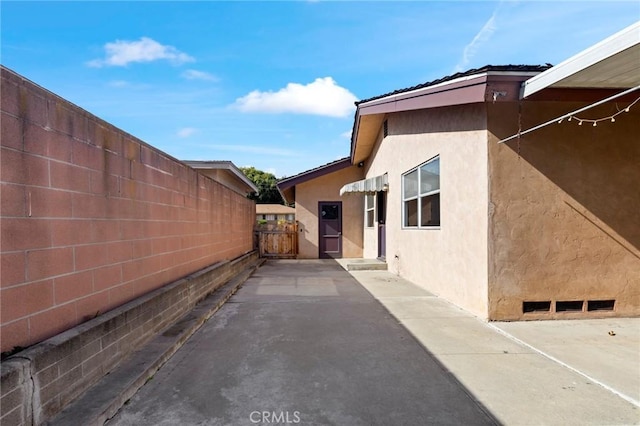 view of home's exterior featuring a patio