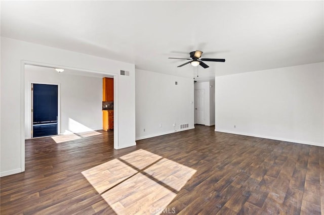 unfurnished living room with dark wood-type flooring and ceiling fan