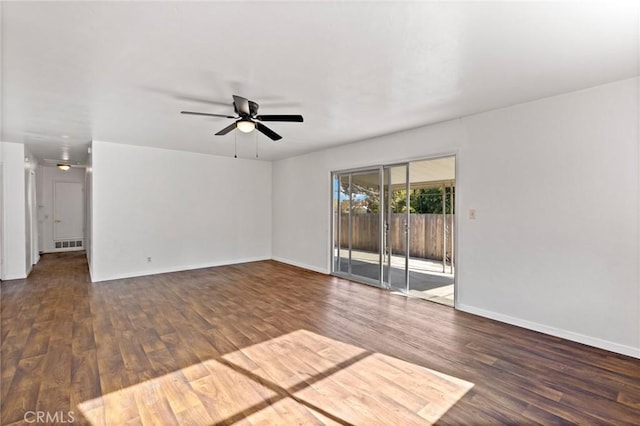 unfurnished room featuring ceiling fan and dark hardwood / wood-style flooring