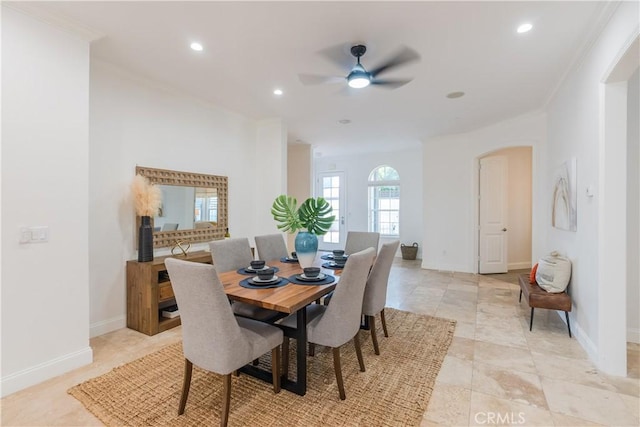 dining space featuring crown molding and ceiling fan