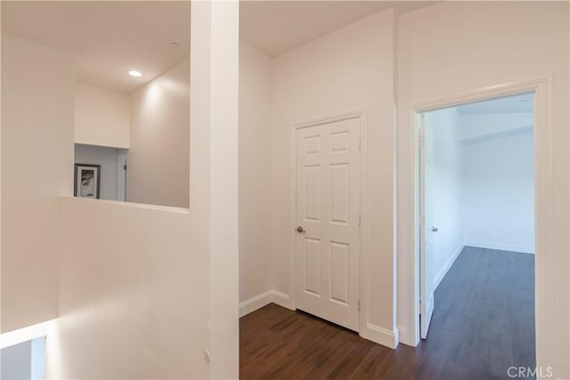 hall with dark hardwood / wood-style floors