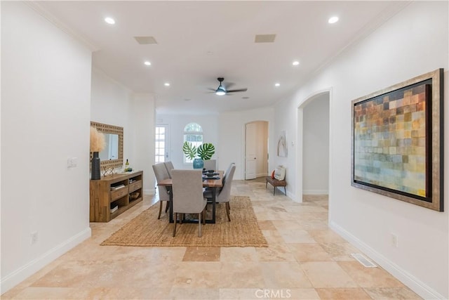 dining space featuring ornamental molding and ceiling fan