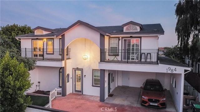 view of front of property with a balcony