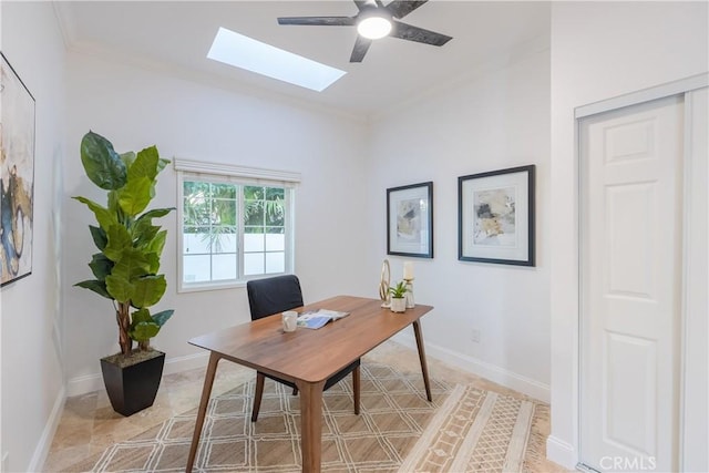 home office featuring crown molding, a skylight, and ceiling fan