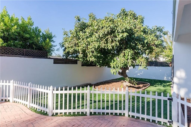 view of side of home featuring a lawn