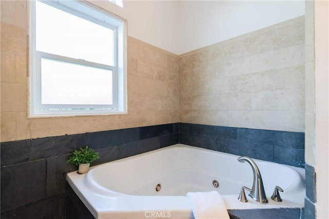 bathroom featuring tiled bath