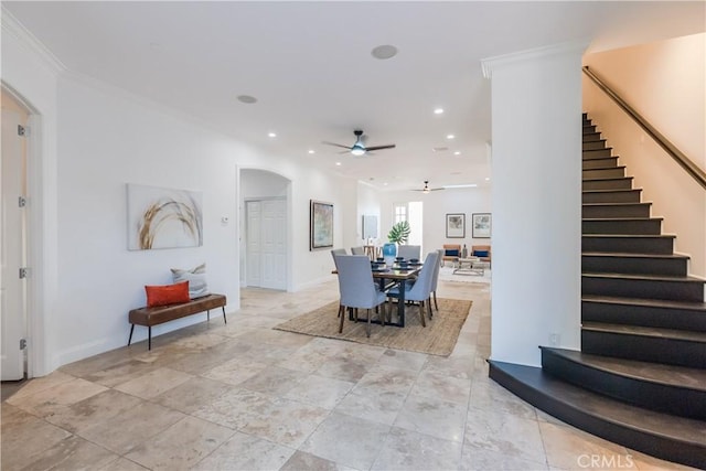 dining area featuring crown molding and ceiling fan