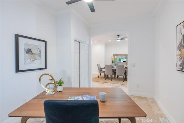 dining room with crown molding and ceiling fan