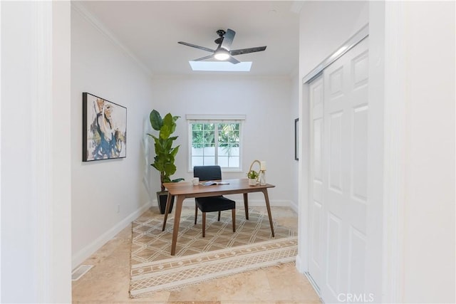 home office featuring ornamental molding, ceiling fan, and a skylight