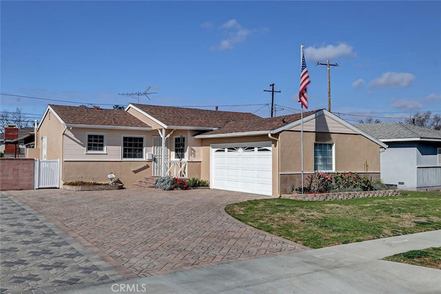 ranch-style house with a garage and a front lawn