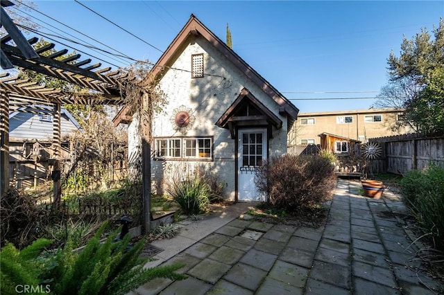 back of house featuring a pergola and a patio area