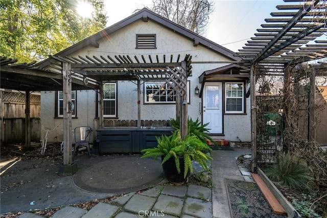 back of house featuring a pergola and a patio area