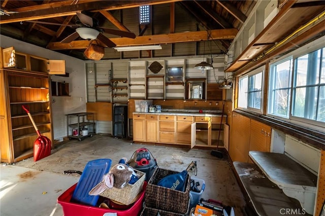 misc room featuring lofted ceiling and concrete floors